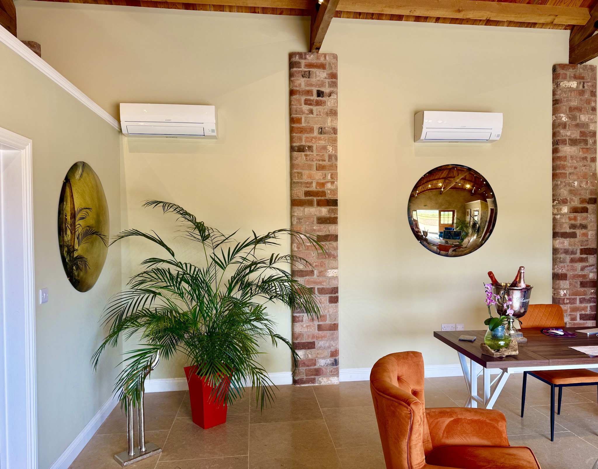 Two hand antique-effect convex mirrors in a clinic reception