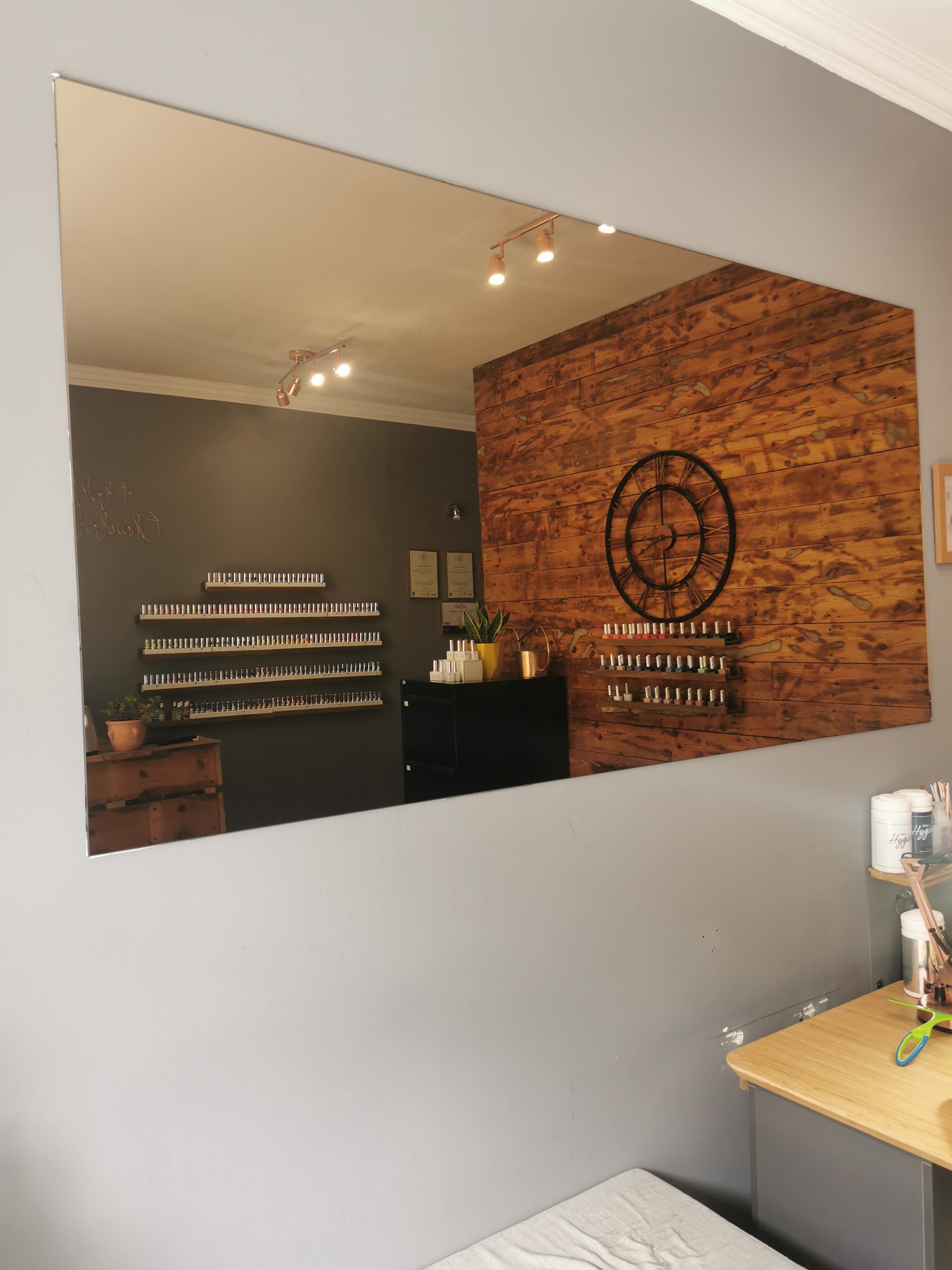 Large frameless wall mirror in a shop interior