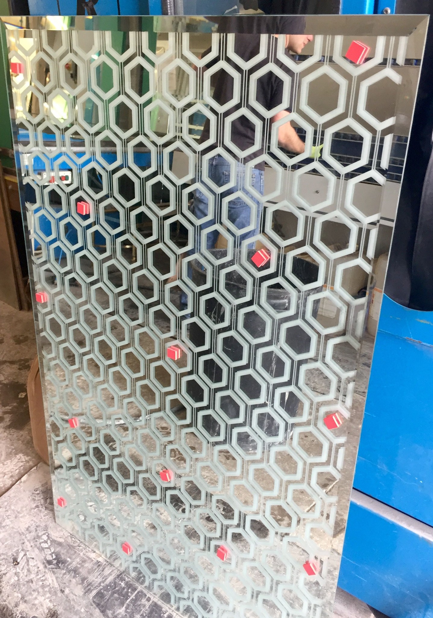 Etched hexagon panel standing in the workshop