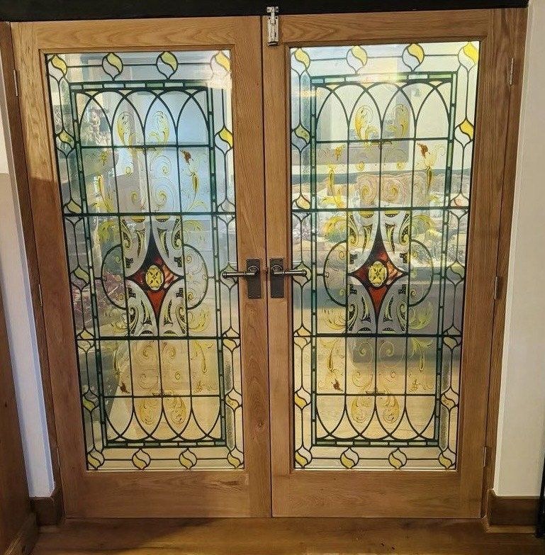 Oak double doors with leaded and stained glass panels