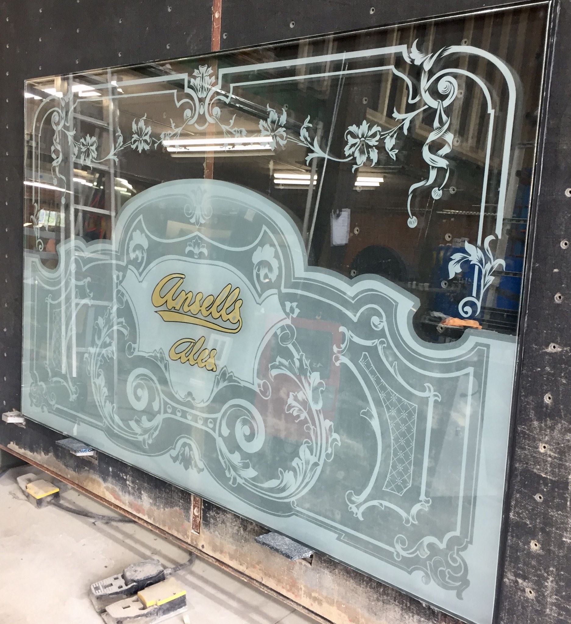 Traditional etched pub window panel for Arkell's Ales on the workshop bench
